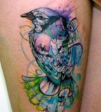 Blue and white bird tattoo