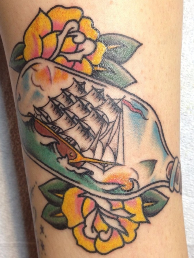 Colorful tattoos by Andy Perez  ship in the bottle