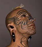 Cruel face tattoo