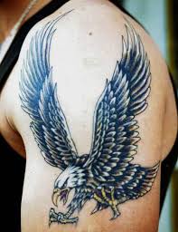 Eagle tattoo on man arm