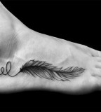 Feather foot tattoo by Ben Volt