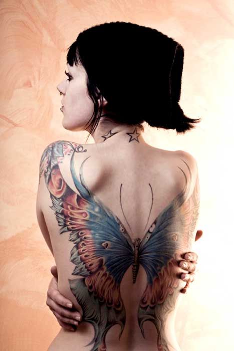 Great  butterfly tattoo on girl shoulder