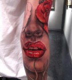 Lips tattoo on arm