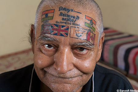 Men head with flags tattoo