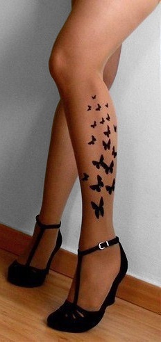 Simple butterfly tattoo on the leg