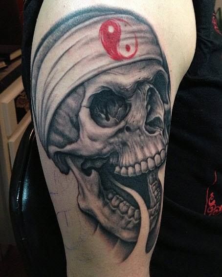 Skull tattoo by Bob Tyrell