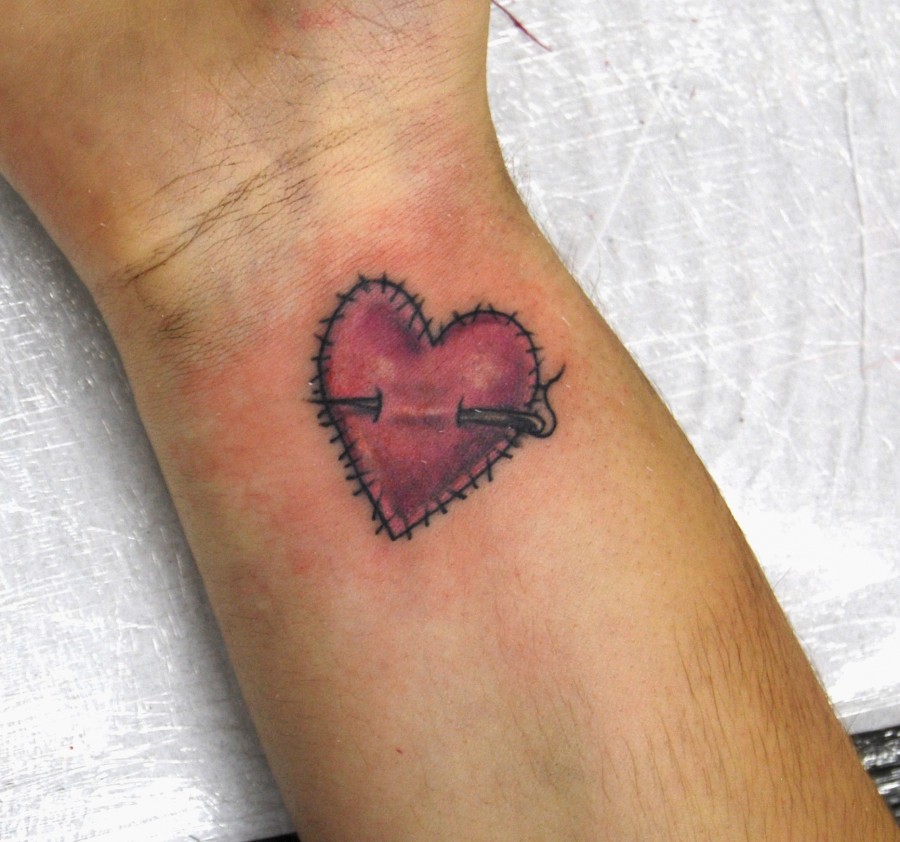 Stiched heart tattoo