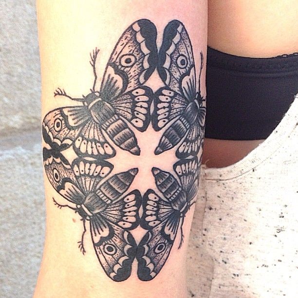 Symmetrical butterfly tattoo