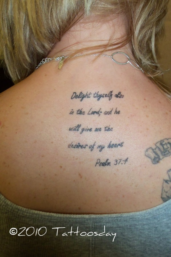 Words tattoo in the back