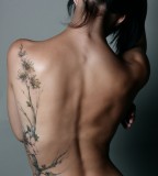 beautiful full lengh floral tattoo blossoms