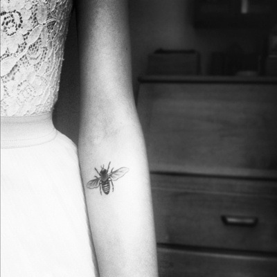 beautiful tattoo placement bee on inside arm