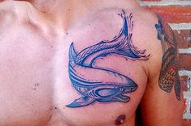 blue ink tattoo shark on chest