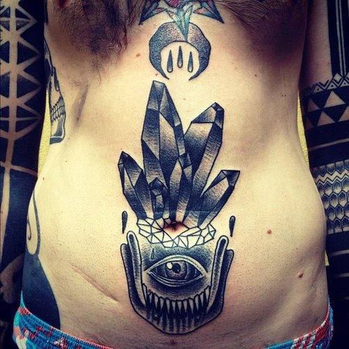 crystal tatoo on stomach