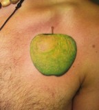 green tattoo green apple on chest