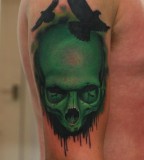 green tattoo skull and birds