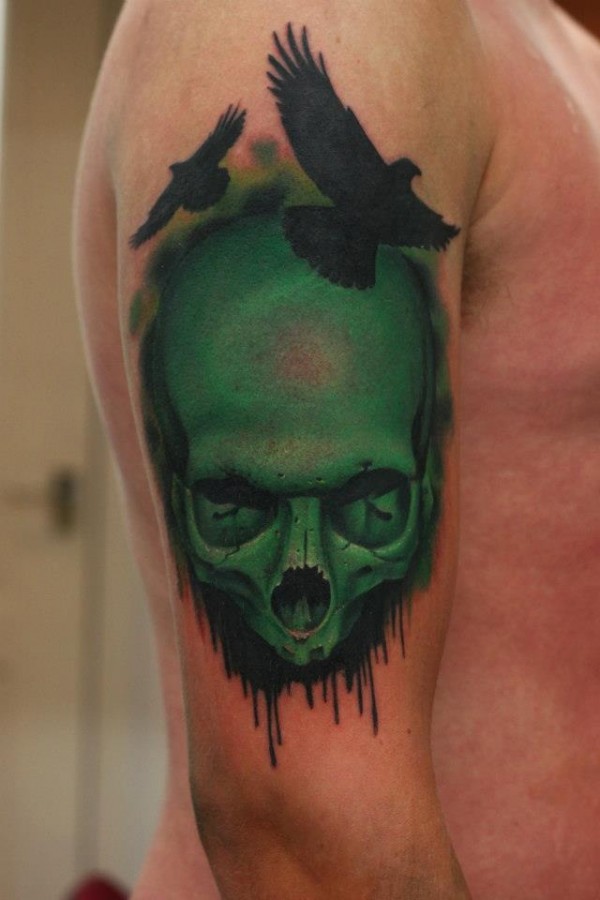 green tattoo skull and birds