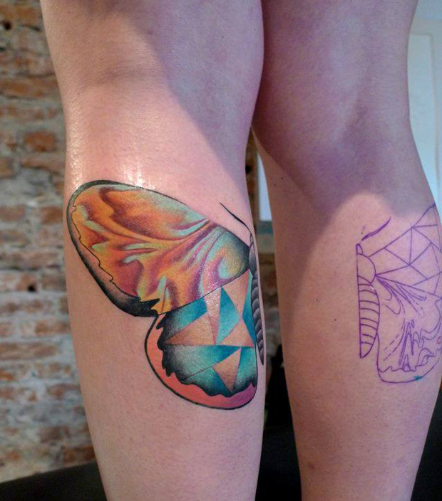 mariusz trubisz butterfly leg tattoo