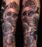 rose tattoo with skulls