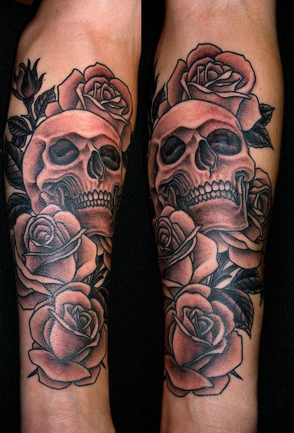 rose tattoo with skulls