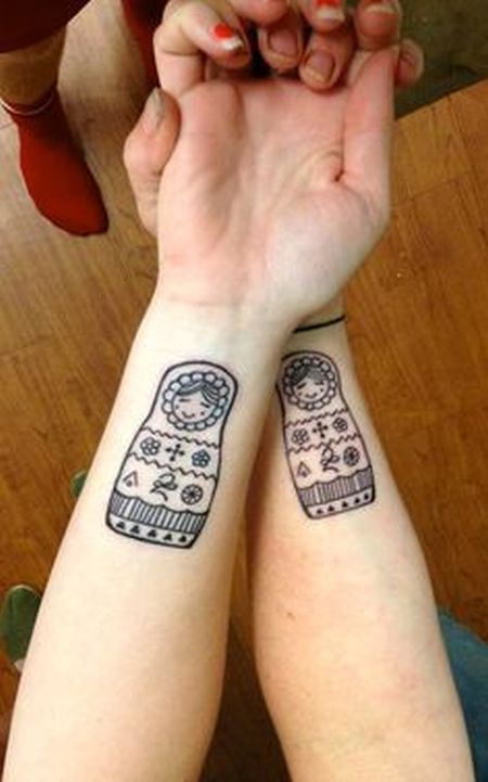 russian doll tattoo inside arms twin matryoshkas