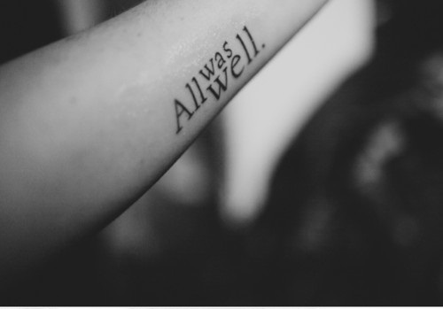 typographic arm tattoo all was well