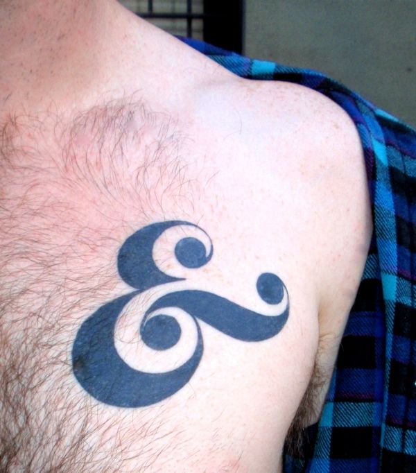 typographic chest tattoo