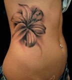 white and black flowers tattoo