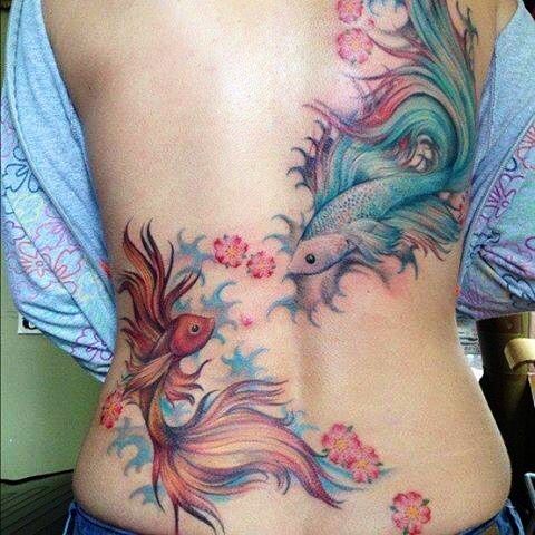 Awesome back fishes tattoo