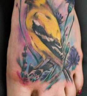 Bird yellow tattoo