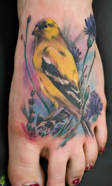 Bird yellow tattoo