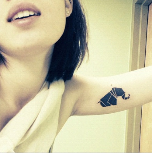 Black elephant origami tattoo