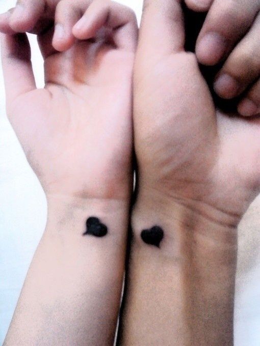 Black heart couples tattoo