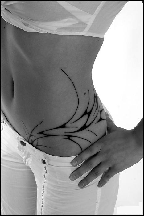 Black hip tattoo