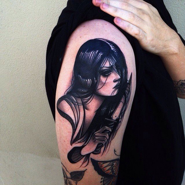 Black woman tattoo by Pari Corbitt