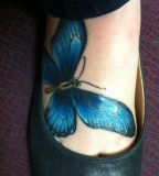 Blue bird tattoo on foot