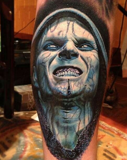 Blue scary tattoo