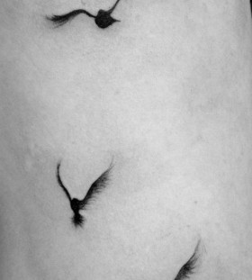 Flying bird tattoo