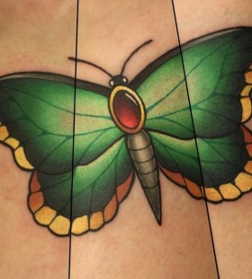 Green butterfly tattoo by Michelle Maddison