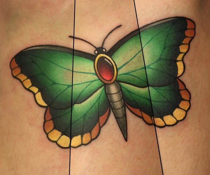 Green butterfly tattoo by Michelle Maddison