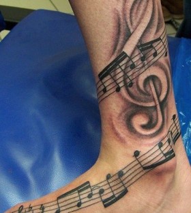 Music tattoo by Andy Engel