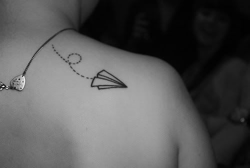 Paper plane origami tattoo