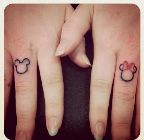 Pretty disney tattoo on fingers