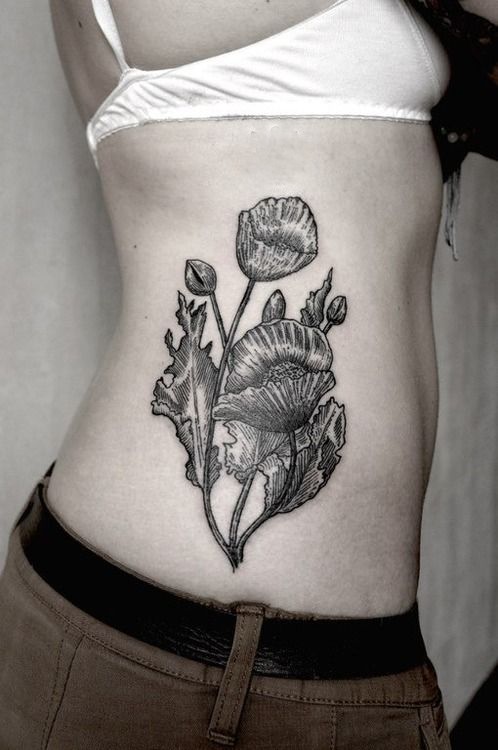 SV.A tattoo flowers on ribs