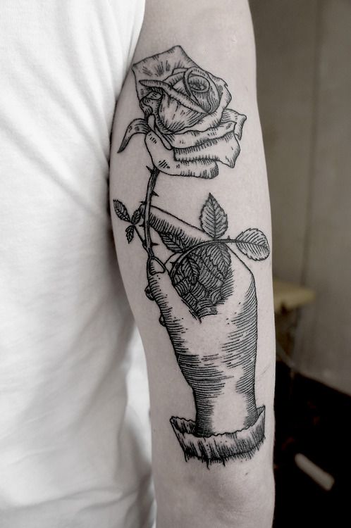 SV.A tattoo hand holding rose