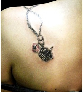 Shoulder crown tattoo