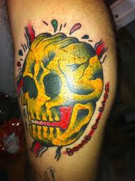 Skull yellow tattoo