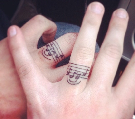 Smile and fingers music tattoo