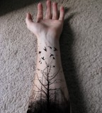 Tree and bird tattoo