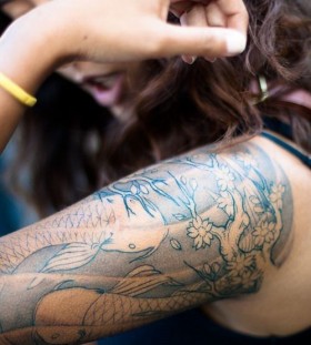 Woman fish tattoo