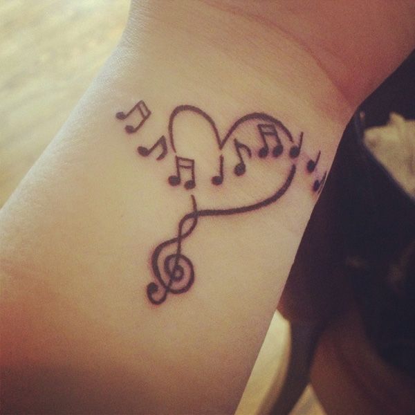 Wrist heart and music tattoo